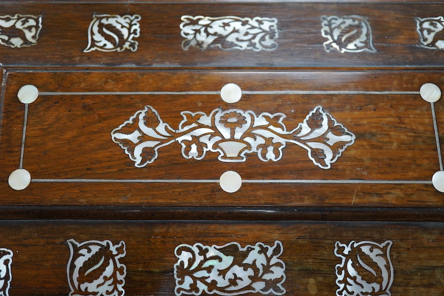 A Victorian rosewood and mother-of-pearl inlaid sarcophagus tea caddy, 39cm wide. Condition - fair